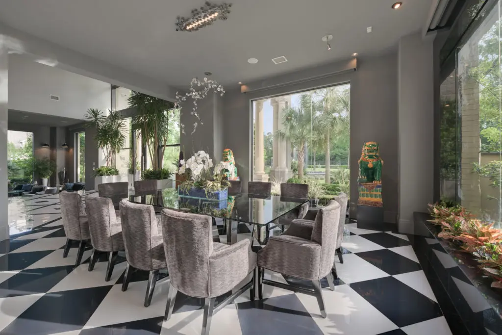 The formal dining room is one of many entertaining areas for the house with two kitchens.