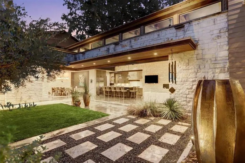 Dyed concrete was introduced outside to complement the 12" x 24" stone pavers for a seamless transition.