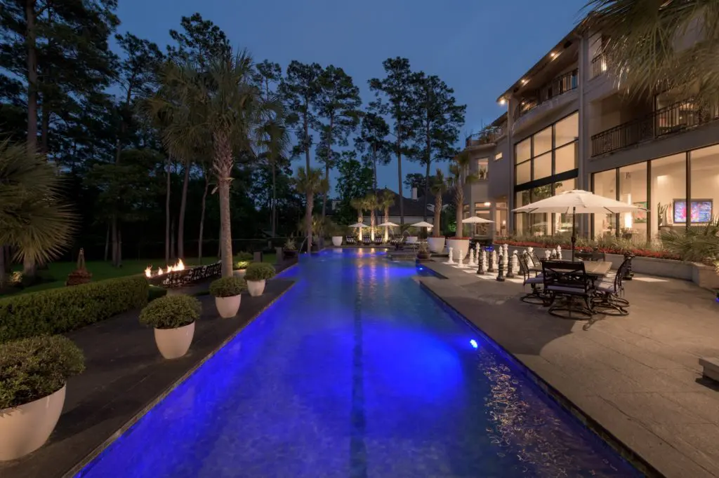 The swimming pool adds exterior glamour to the dwelling.