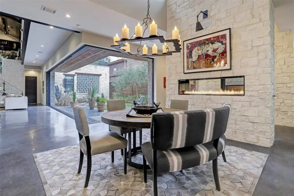 Glass doors open wide to deliver outdoor/indoor living. 