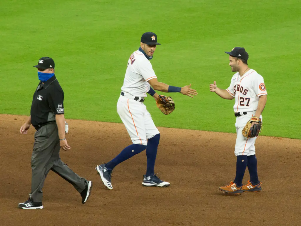 Carlos Correa and Jose Altuve know how to win baseball games. (Photo by F. Carter Smith)