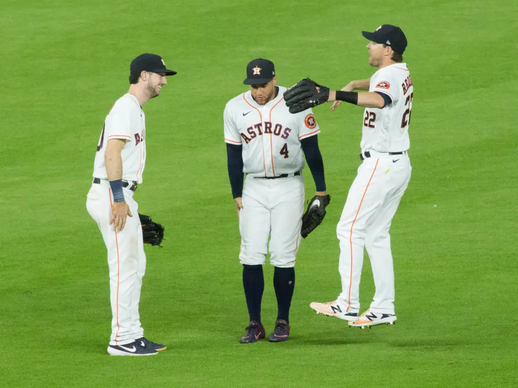 Kyle Tucker, George Springer and Josh Reddick enjoy a little outfield party. (Photo by F. Carter Smith)