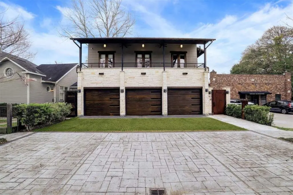 The striking facade of the two-story home celebrates the contemporary with design saluting the past.