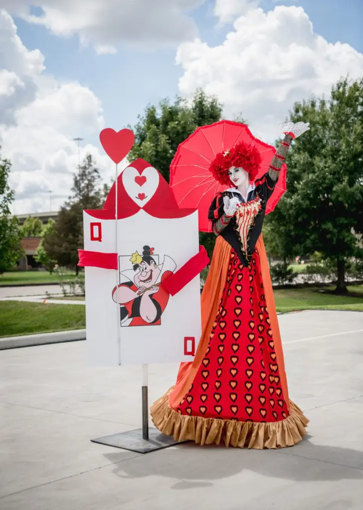 A towering Queen of Hearts leads the drive-through tea party. (Photo by  Brandy Stoesz Photography)
