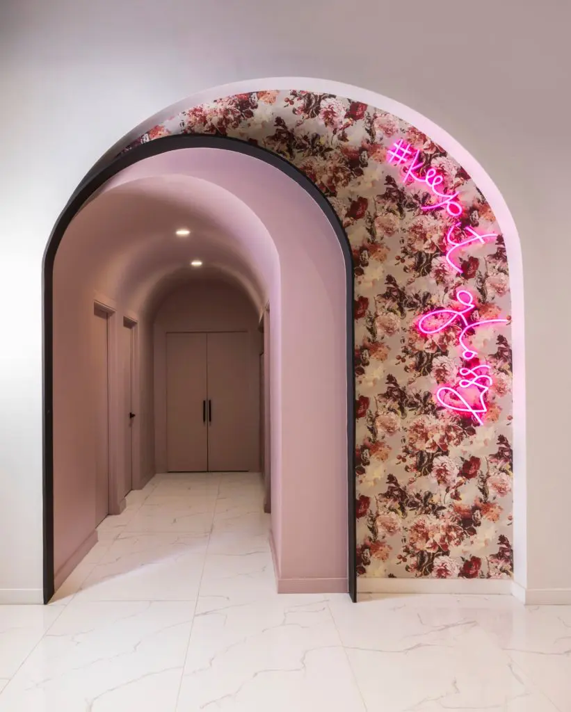 A floral Instagram-able wall at Gloss Nail Bar