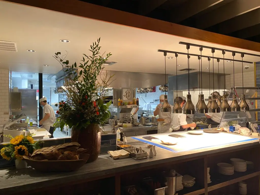 A view to the open kitchen from where Chef Aaron Bludhorn delivers his exceptional cuisine. (Photo by Shelby Hodge)