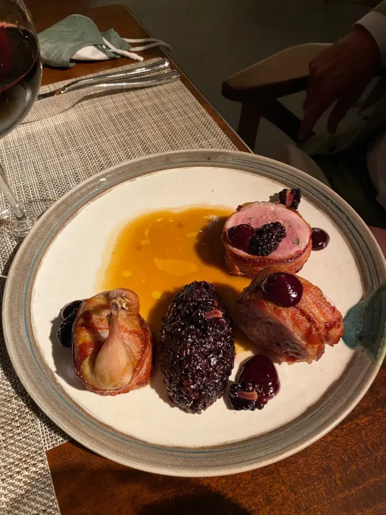 The roasted quail dish with quail forcemeat and a huckleberry compote (Photo by Shelby Hodge)