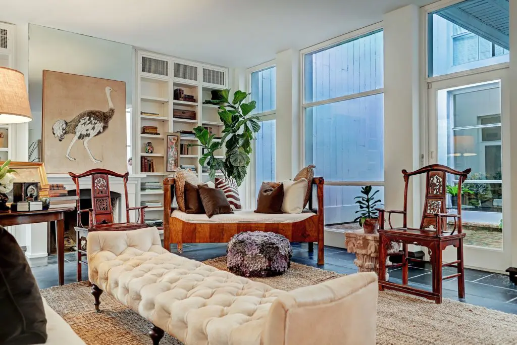 The living room in this mid-century modern home in Houston's Tanglewood neighborhood opens to one of two interior courtyards.  (Photo by TK Images)