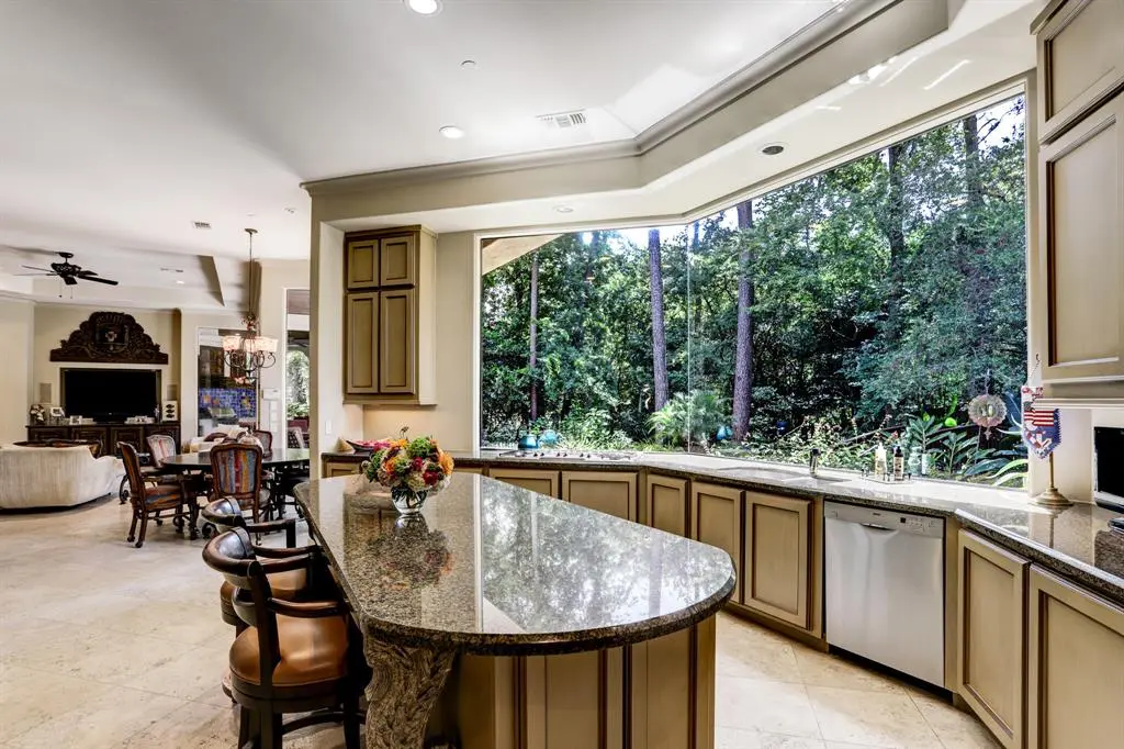 The kitchen flows seamlessly into the den.