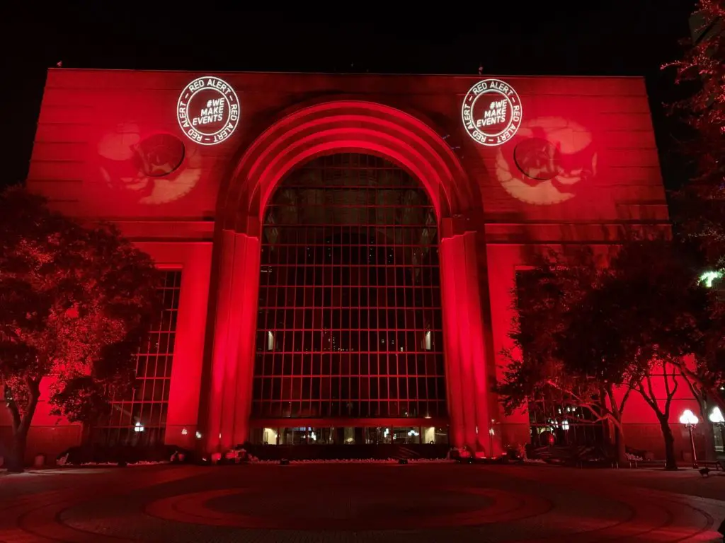 Wortham Theater Center is lit up in red as a nod to the national effort to encourage Congress to support aid for the live entertainment and events industry. (Photo courtesy of Houston First)