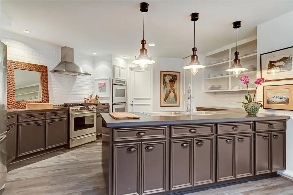 The kitchen at 5000 Longmont has been updated from its original mid-century design. (Photo by TK Images)