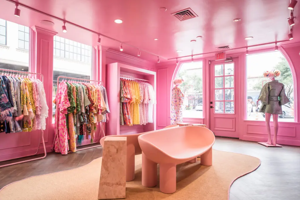 Interiors are styled to resemble a pink Parisian jewelry box. 