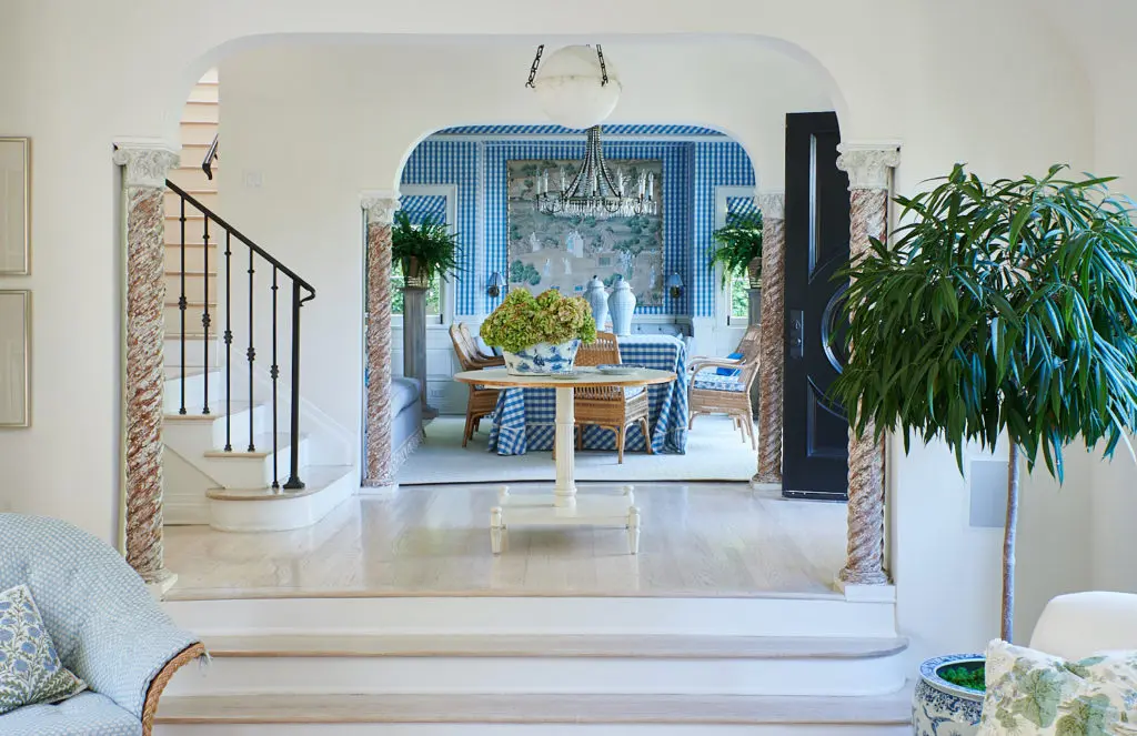 A beautiful view into the dining room of Mark Sikes's home, dressed in a blue and white biased gingham from Brunschwig & Fils. (Photo Amy Neunsinger)