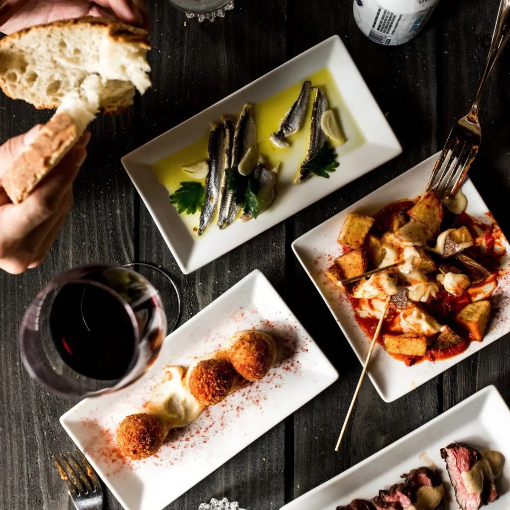 Favorite tapas at Barcelona Wine Bar include patatas bravas and Brussels sprouts. (Photo by Manny Vargas)