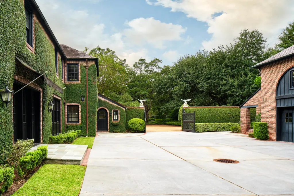 The three car garage at 2 Longfellow Lane is flanked by the coach house which has full quarters on the second floor. (Photo by Nathan Schroder/Douglas Elliman)