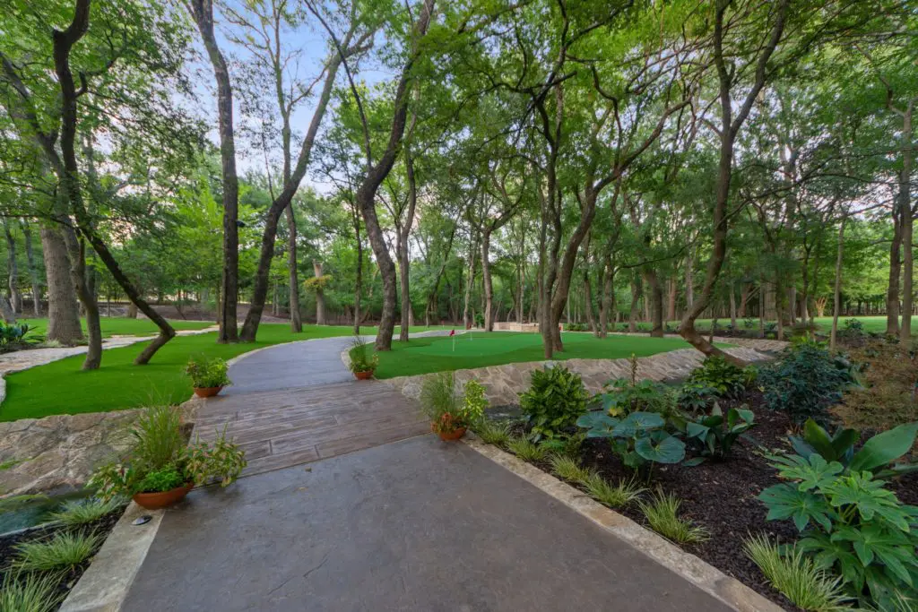 A private well and underground rainwater storage tanks, 6,000 gallons each, cover irrigation for the landscape.