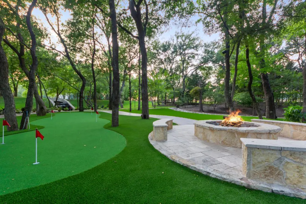 The winding putting greens are adjacent to the fire pit where the surrounding stones are heated. The entire area is lighted for nighttime use and has Bluetooth surround sound in the canopy of trees.