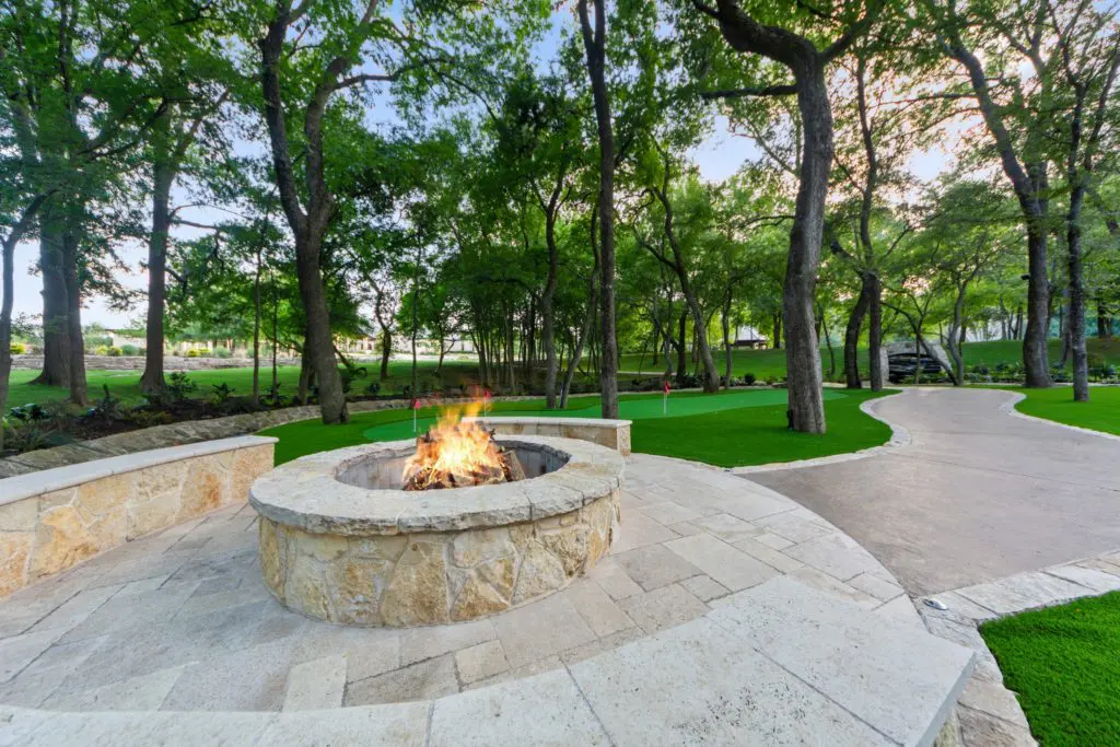 Another view of the fire pit and putting greens