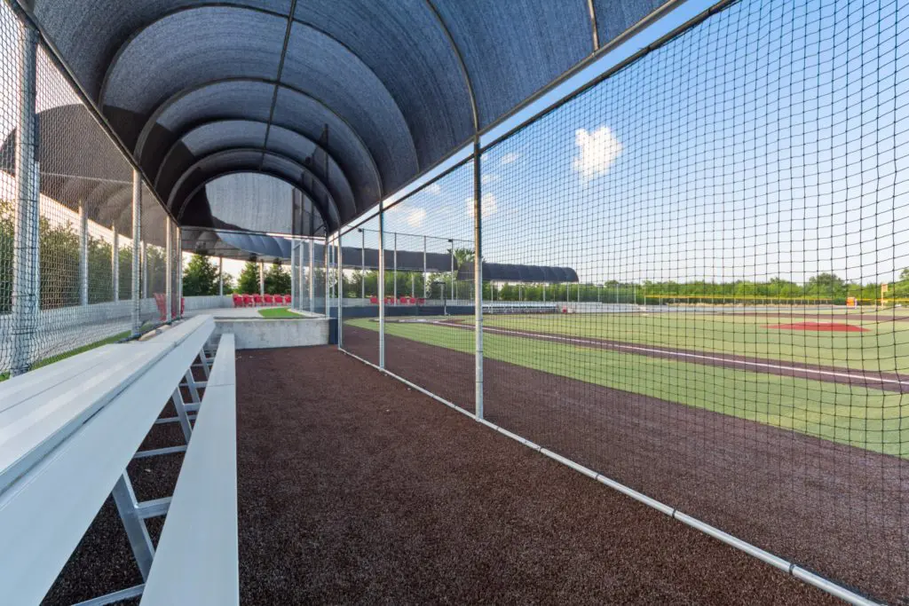 The turf baseball field, complete with covered seating and dugouts, is built with crushed granite and mat so that water drains