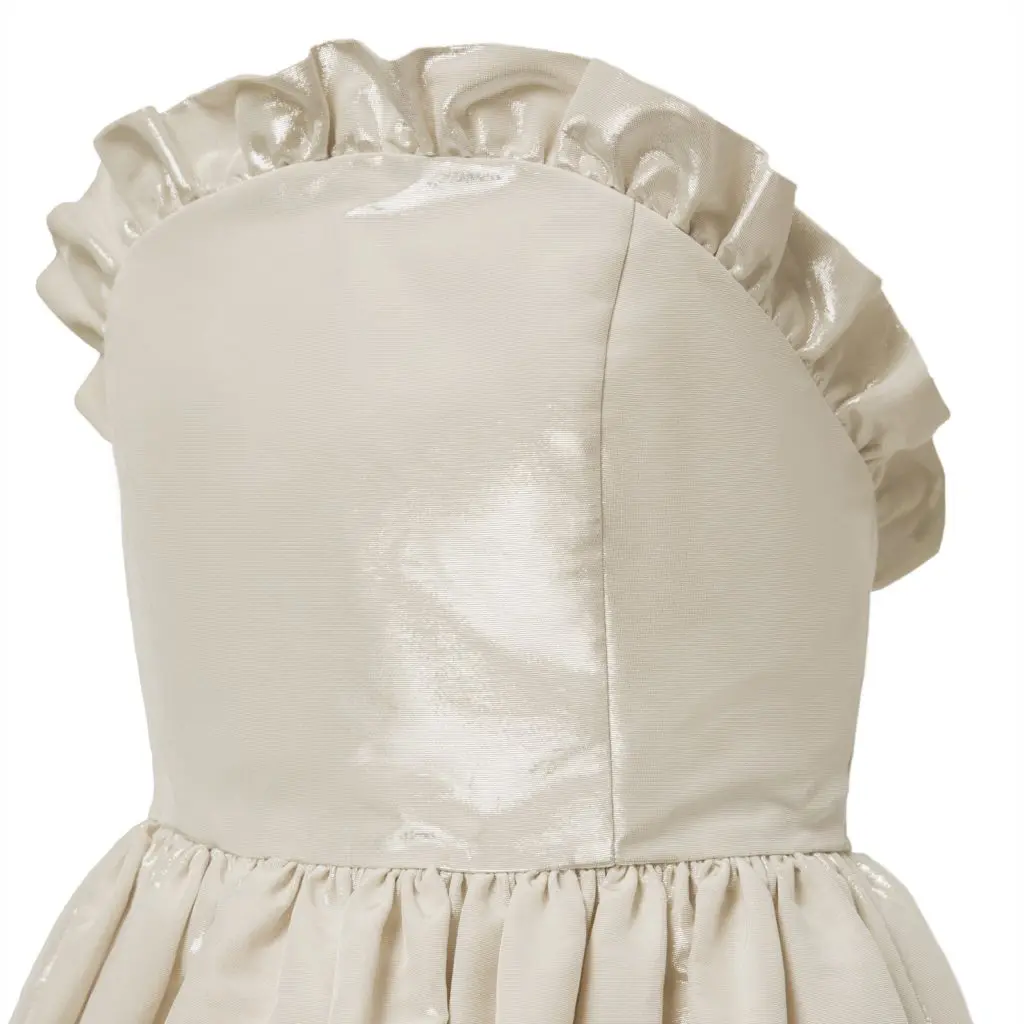 Details on a couture gown that reflects Shaikh's own style: "classic and clean with feminine touches of bows and ruffles." 