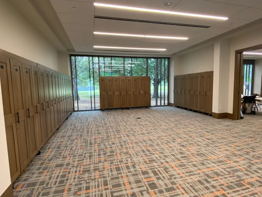 Four classrooms are lined with banks of portable golf lockers that when turned around reveal white boards for instructors.
