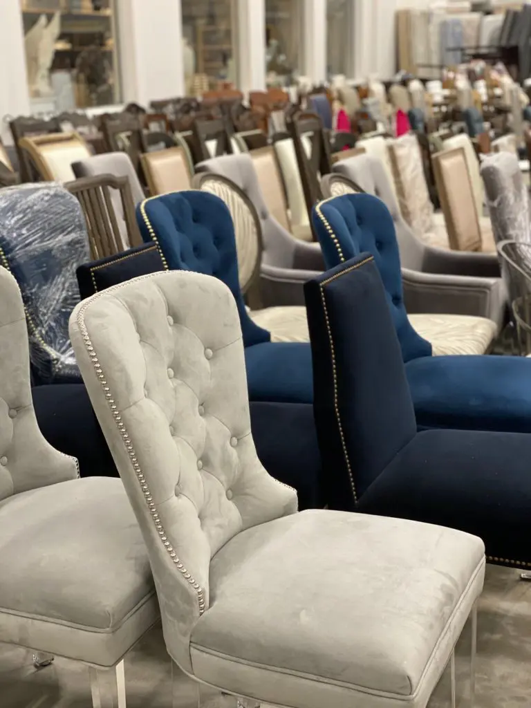 An ocean of dining chairs takes over part of the home staging warehouse of real estate agent David B. Atkins. (Photo by Shelby Hodge)