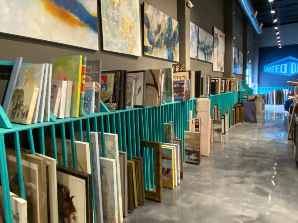 Some 300 paintings, several commissioned from Blakely Bering, are at the ready for home staging. (Photo by Shelby Hodge)