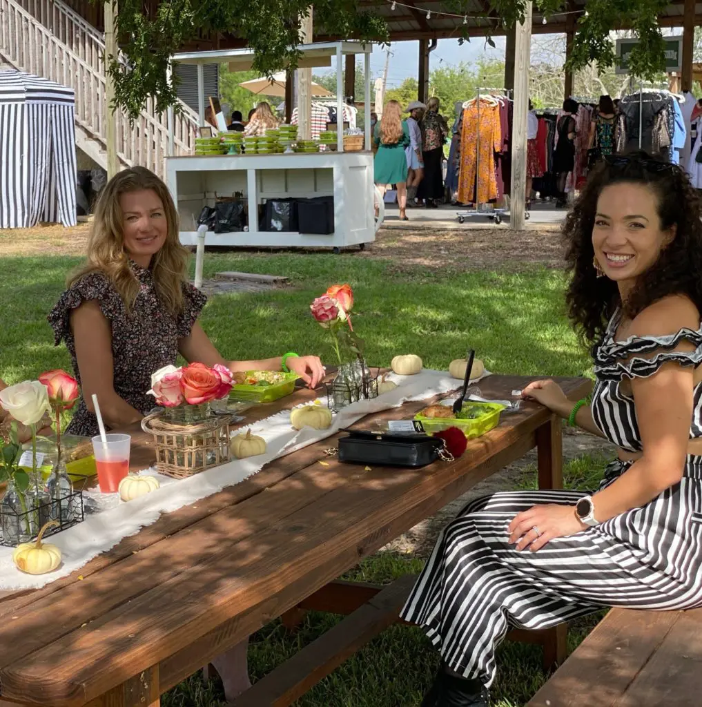 Taylor Larson and Erika Taugher picnicking on treats from Salata at Hope Farm's Fashion in the Fields outing benefiting Recipe for Success.  (Photo by Shelby Hodge)