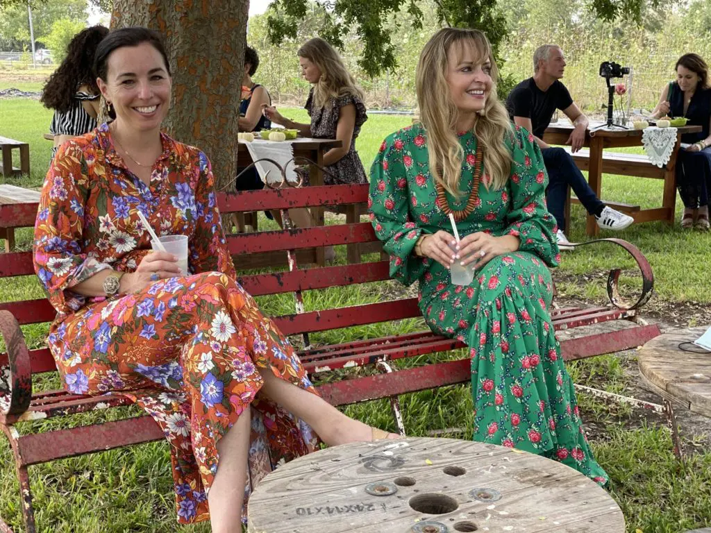 Goodie Rental Co.'s Karen Johnson and calligrapher Jen McDonald enjoy a lemonade beneath the oaks at Hope Farm's Fashion in the Fields outing benefiting Recipe for Success.  (Photo by Shelby Hodge)