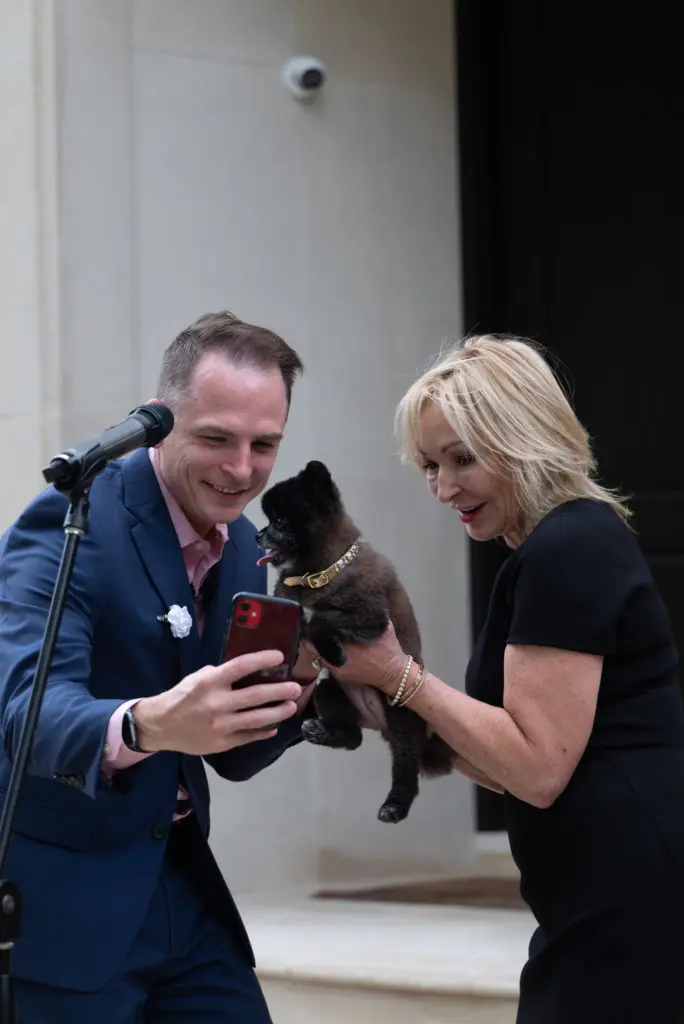 Johnny 'Bravo' Holloway and Julie Brookshire take a selfie with precious Lila at the CAP gala. (Photo by Daniel Ortiz)