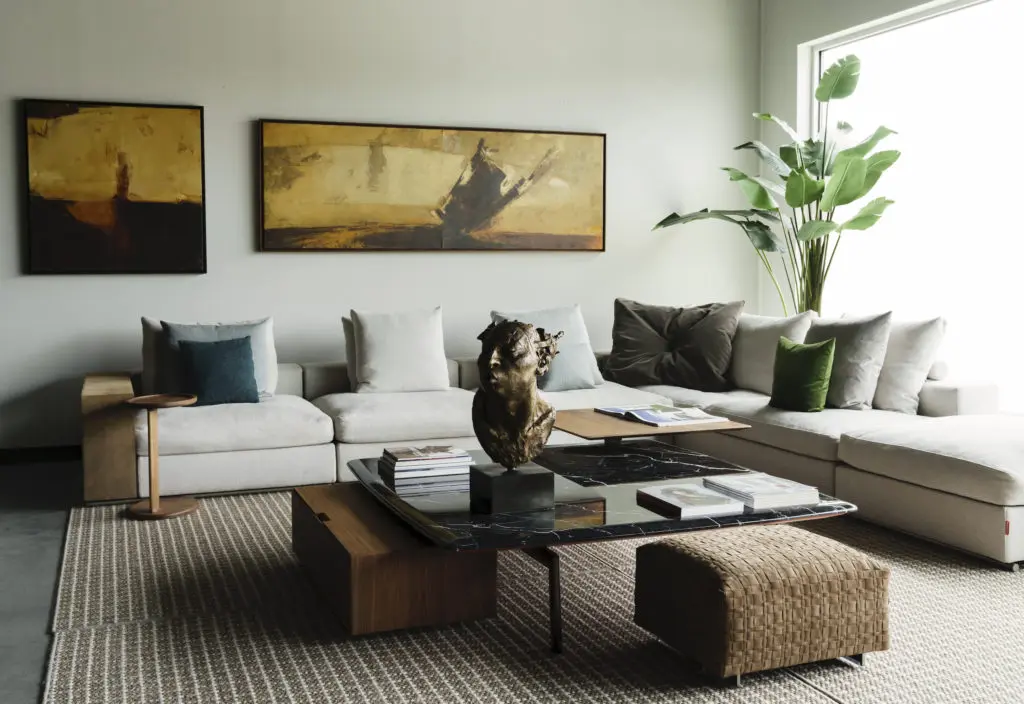 Franco Fasulo paintings from Art of the World  Gallery, which has joined BeDesign in a percentage-of-sale fundraiser for Houston Grand Opera. All furnishings from BeDesign. Flexform Groundpiece Sectional Sofa, Fly Table, Oliver Small Table, Bangkok Ottoman and Casa Casati Sasso Coffee Table
 (Photo by Jack Thompson)