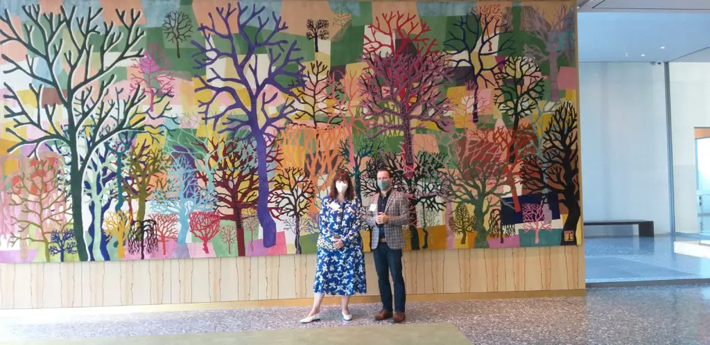 MFAH curator Alison de Lima Greene, and Odabashian's Jaime Odabachian with Trenton Doyle Hancock's "Color Flash for Chat and Chew, Paris Texas in Seventy-Two," 2019-2020, in the Kinder Building space destined for Michelin-chef concept Le Jardinier. (Photo by CDA)