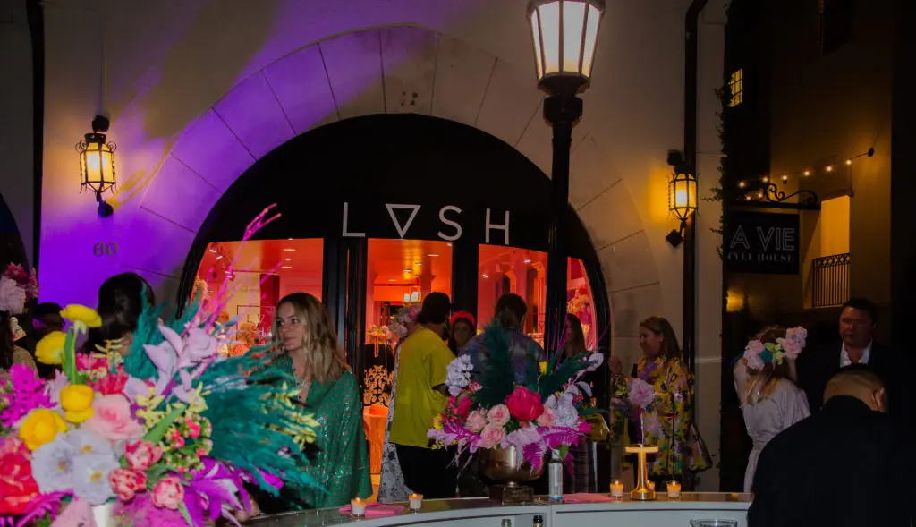 Most of the action was hosted outside the boutique, where bright pink walls transformed a section of the shopping center’s parking lot into La Vie’s own personal patio.  (Photo by Cassandra Willis)