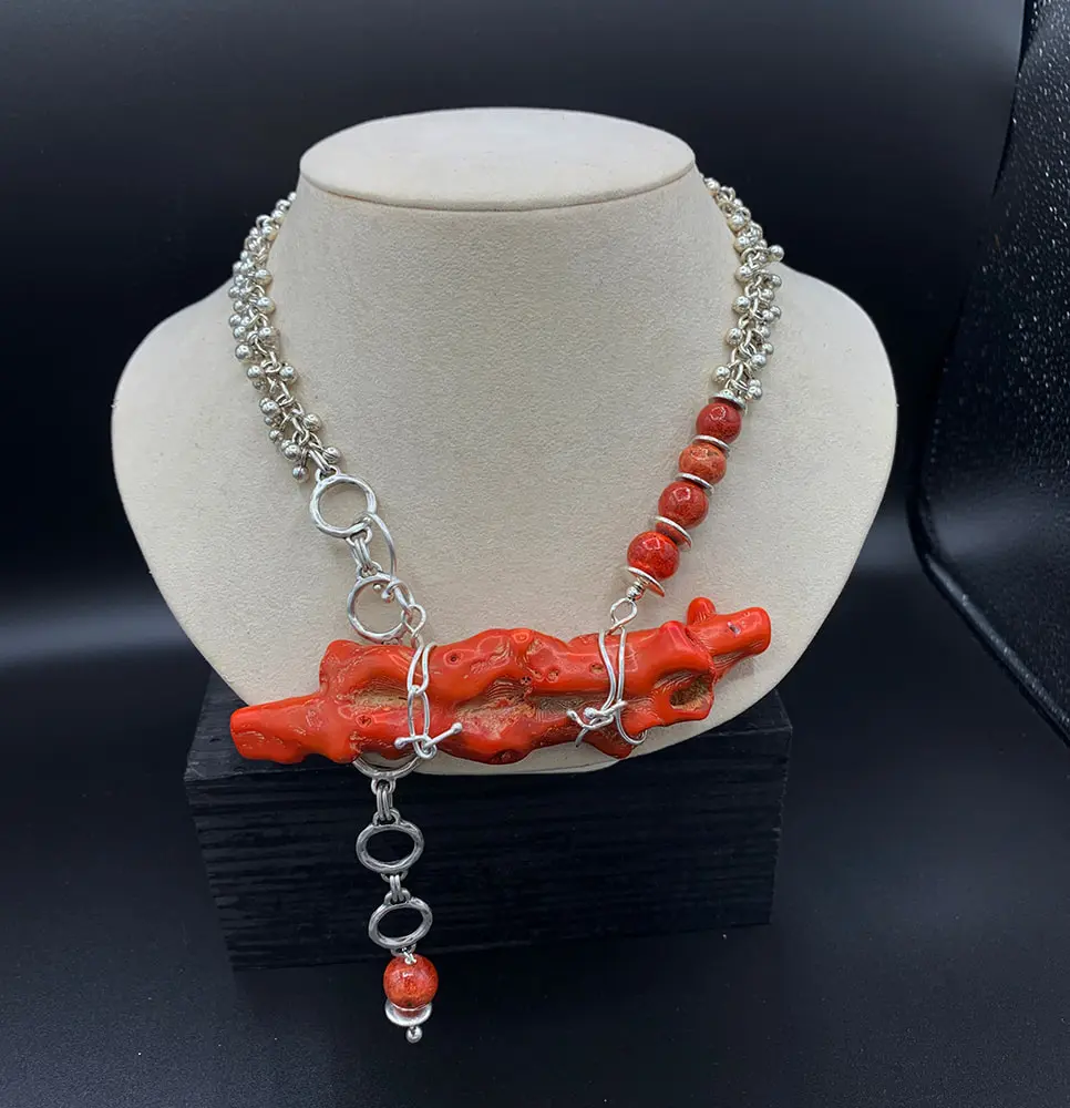 Some of the coral in her design is forty plus years old -  Big Coral Branch set with silver.