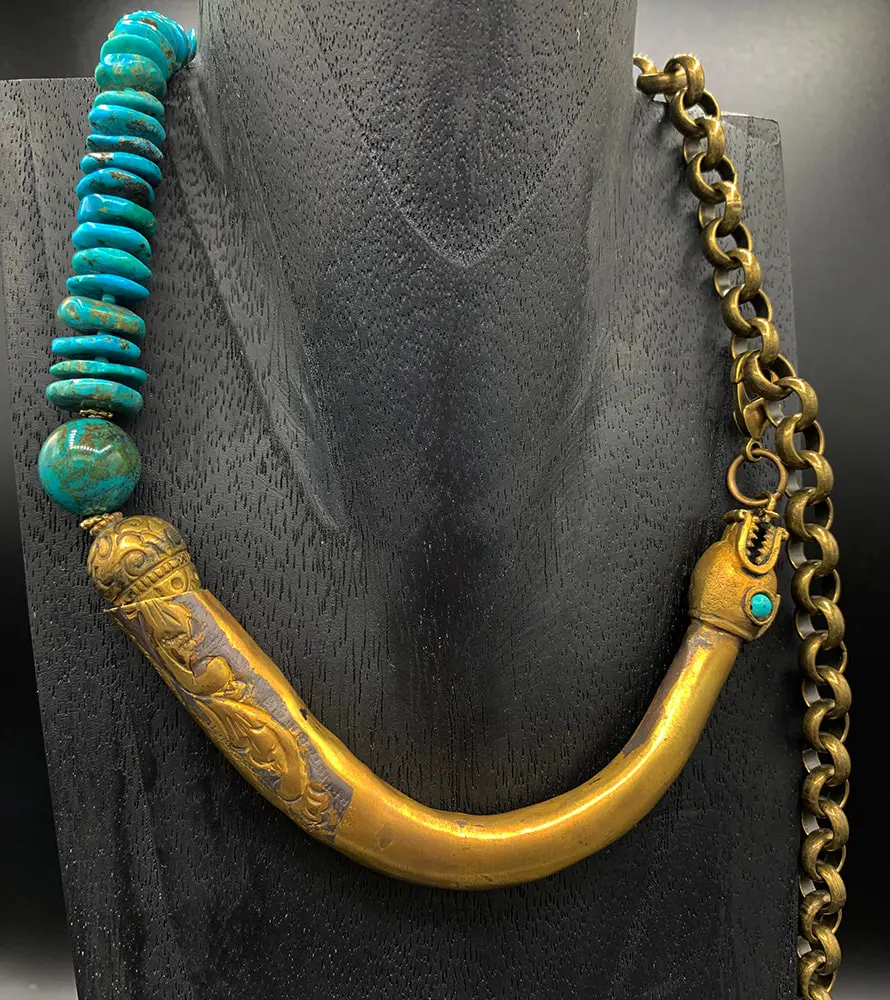 Brass Dragon necklace incorporates antiquities into the design.
