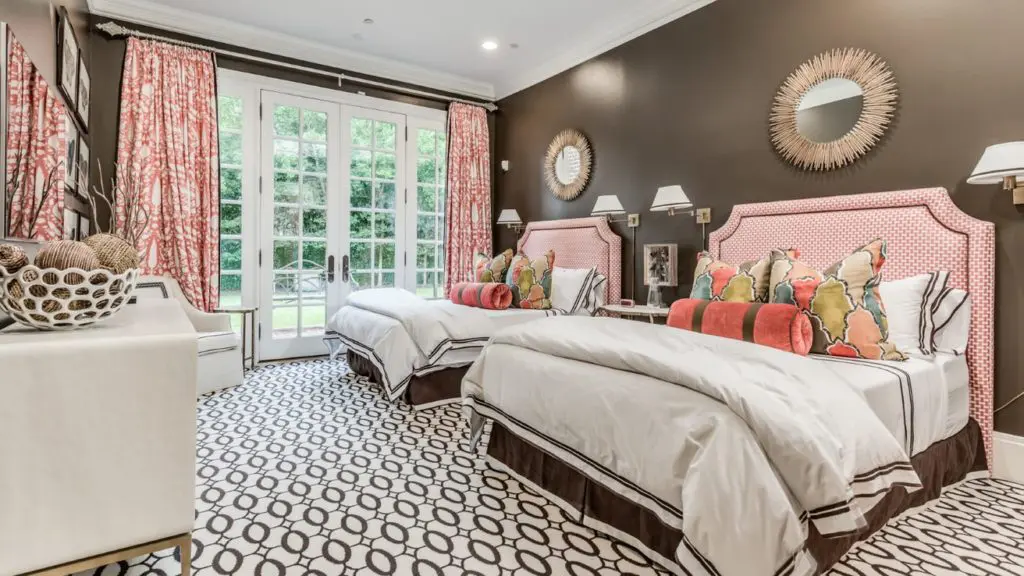 Yummy guest bedroom in soothing chocolate brown with coral accents.