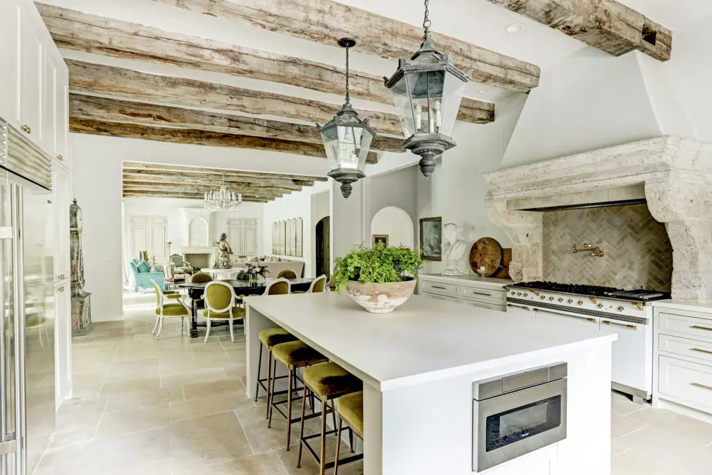Antique beams stretch from the open kitchen to the family room at  722 E. Friar Tuck Lane.