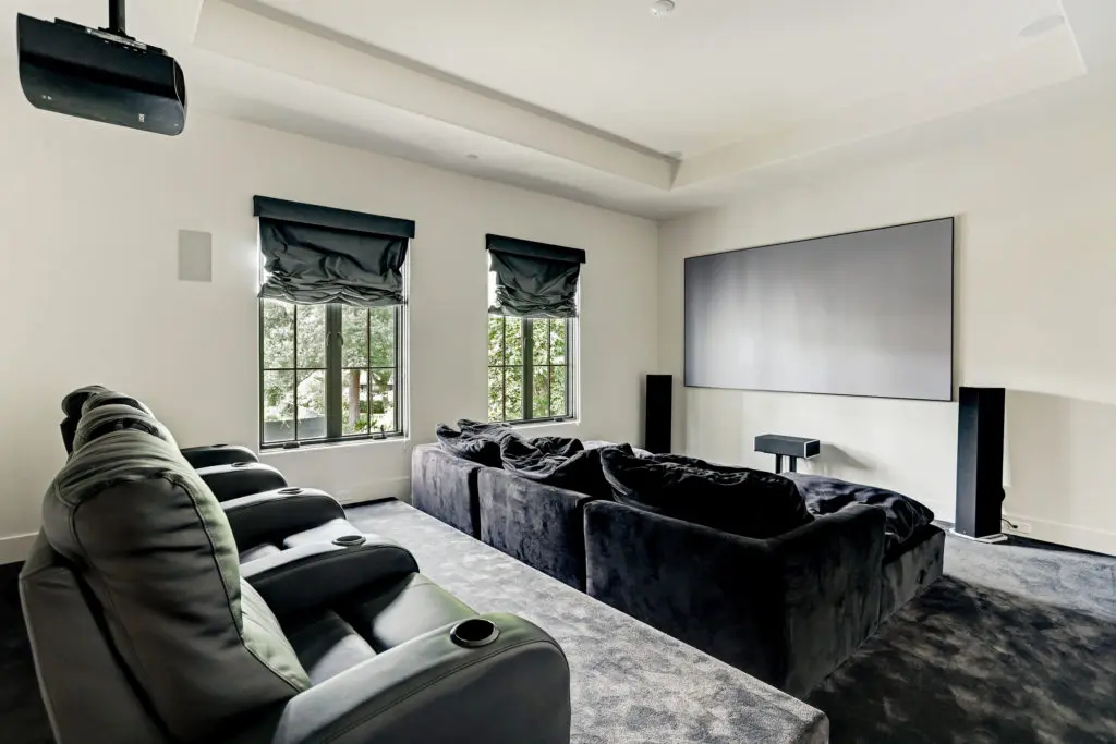 In addition to six bedrooms, the dwelling at 722 E. Friar Tuck Lane has a home theater.