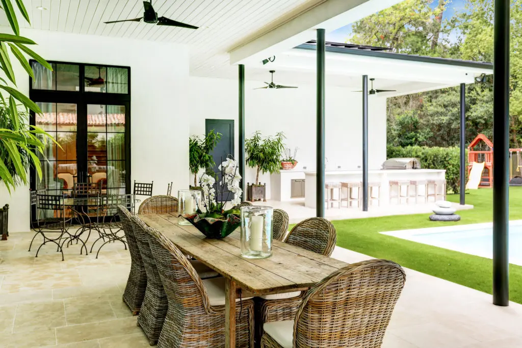 The spacious outdoor summer kitchen/living area at 722 E. Friar Tuck Lane has a home theater.