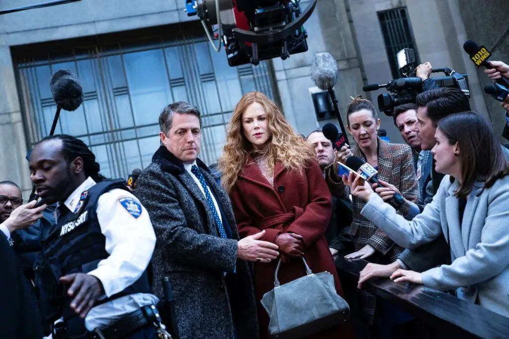 Hugh Grant and Nicole Kidman are surrounded by inquisitive news media in this scene from HBO's 'The Undoing.' (Photo by Niko Tavernise, courtesy of HBO.)