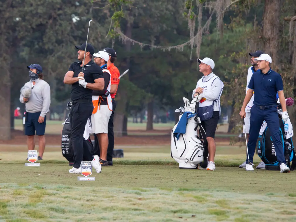 Jordan Spieth watches Brooks Koepka take a shot at the Houston Open. (Photo by F. Carter Smith)