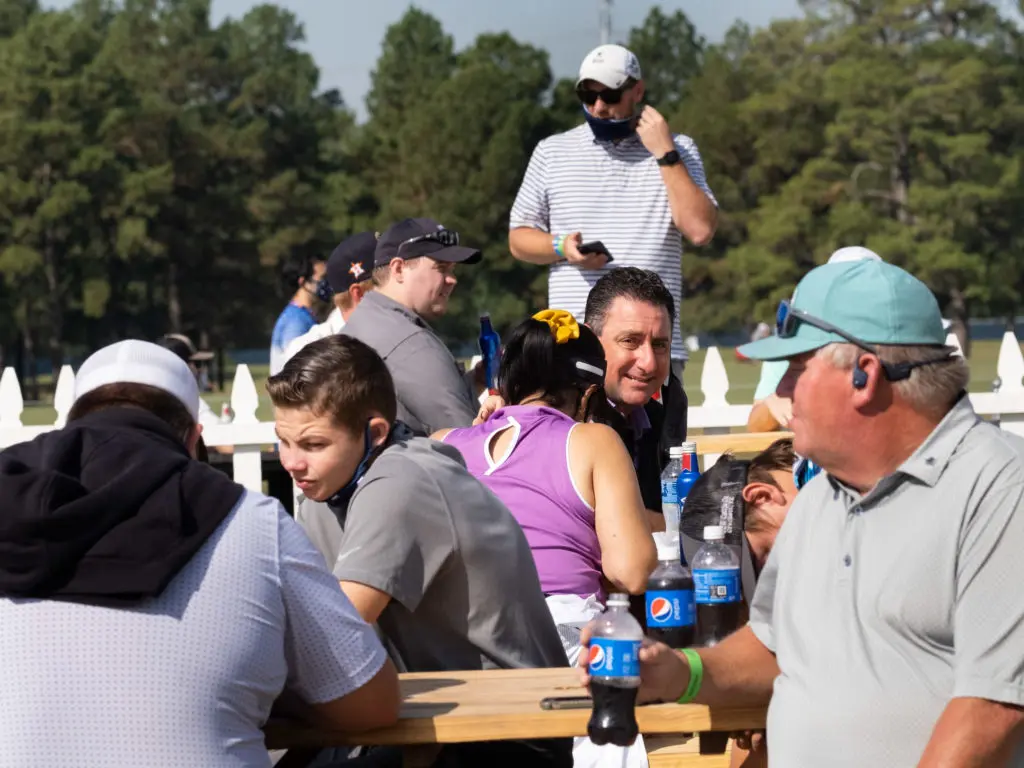 Fans are enjoying the outside picnic tables and cushiony seats at the Houston Open. (Photo by F. Carter Smith)