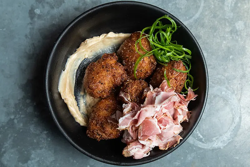 Hush Puppies are among the Southern Comfort foods to be on the One Fifth menu beginning December 8. (Photography by Jacklyn Warren for StarChefs) 