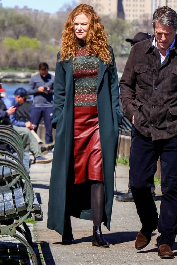In a long blue coat, Nicole Kidman strolls with Hugh Grant in a scene from HBO's 'The Undoing.' (Image courtesy of HBO. )