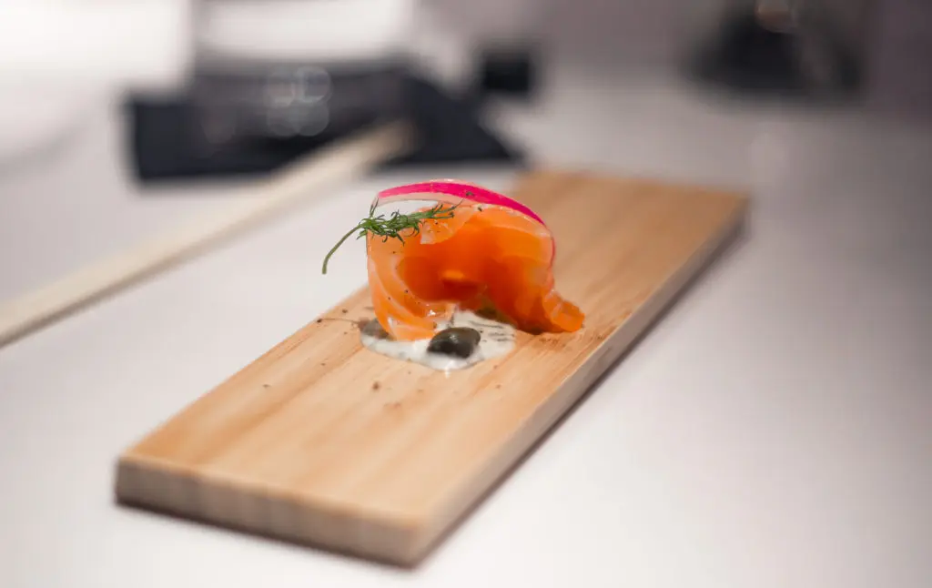 One of Hidden Omakase's 12-courses could be fresh salmon with sauce. Depending on which night you go. (Photo by Katoe Productions)