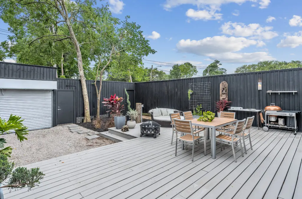 The patio deck in the Nouveau Bungalow provides additional living space in the house sited at the back of the lot.