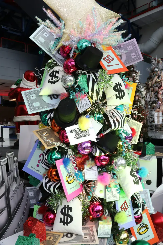 The Alley Theatre Deck the Trees display of decorated conifers. The Monopoly tree by Holli Day Decor.