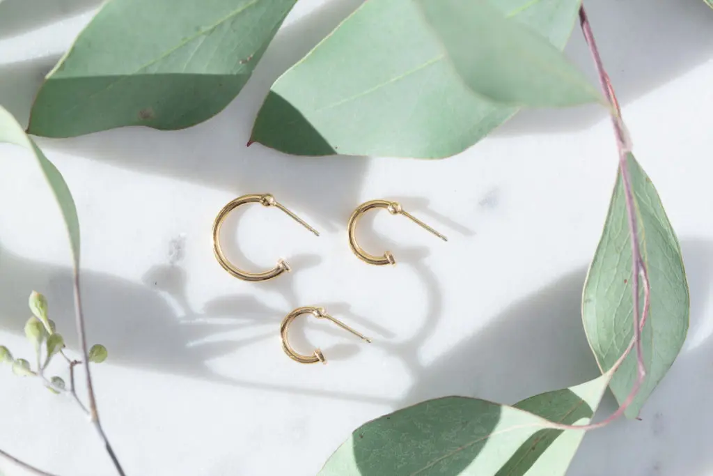 The 10k capsule collection includes classic hoops ($120 - $360), which can be accessorized with Bijoux. 