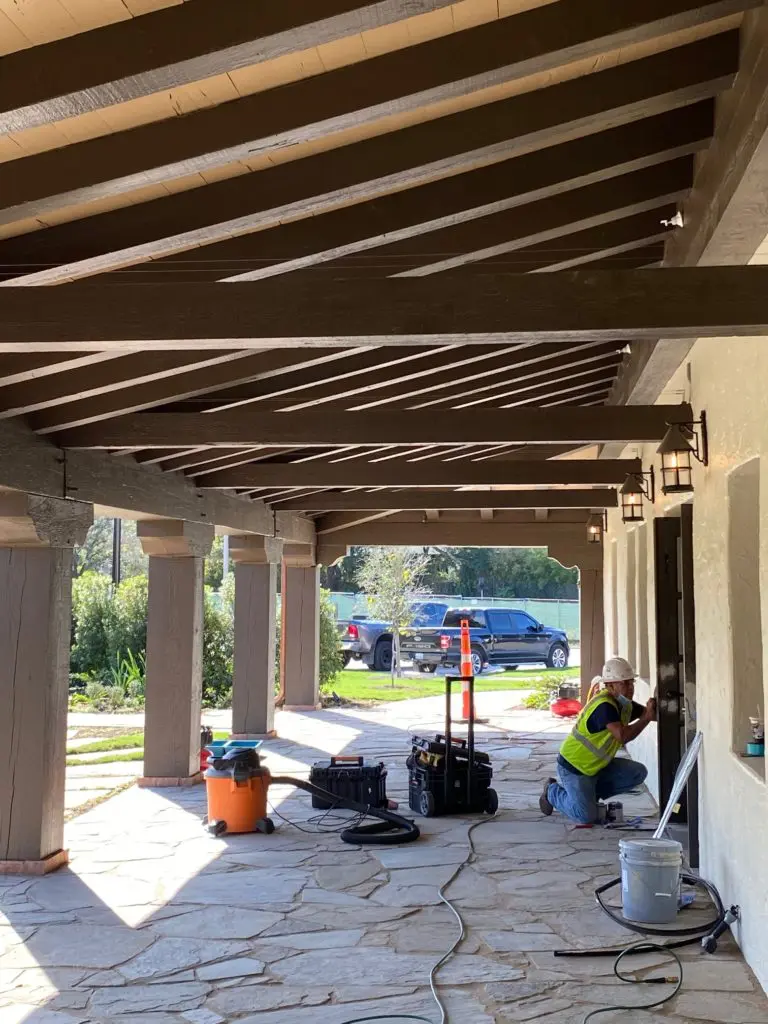 The back gallery of Lott Hall in Hermann Park overlooks a lawn that leads to the Hermann Park Golf Course.  (Photo by Shelby Hodge)