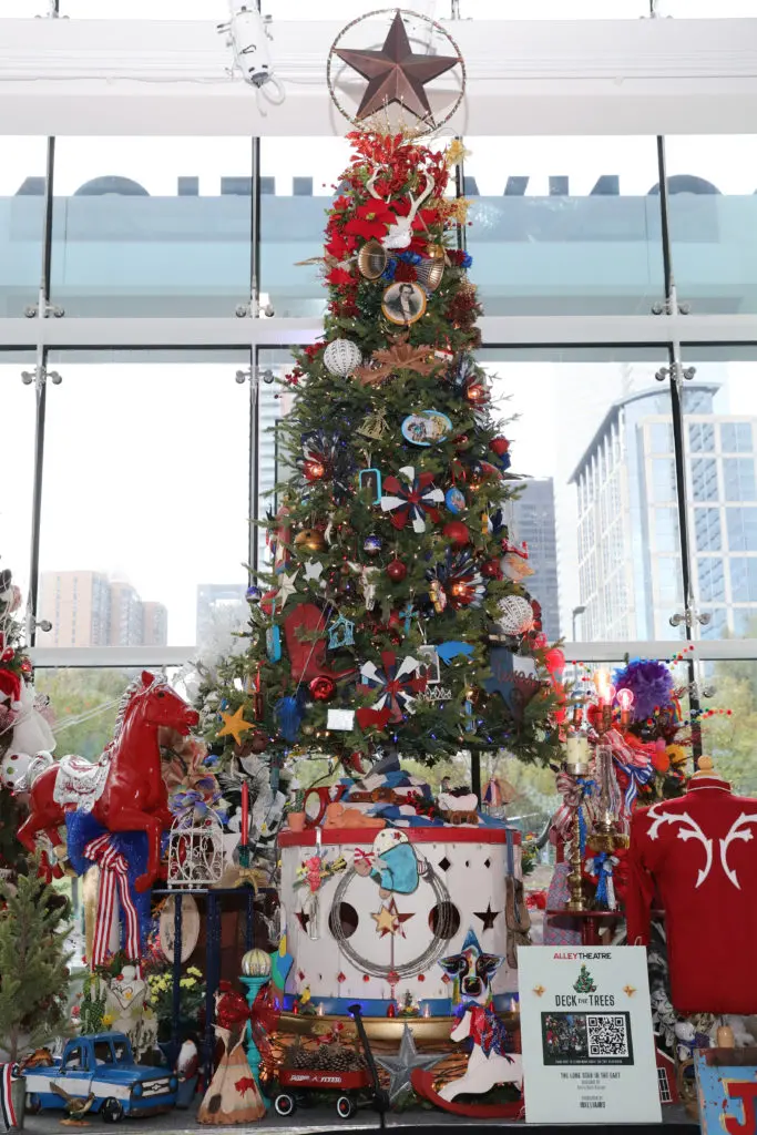 The Alley Theatre Deck the Trees display of decorated conifers. The Lone Star in the East tree by Barry Doss Design.